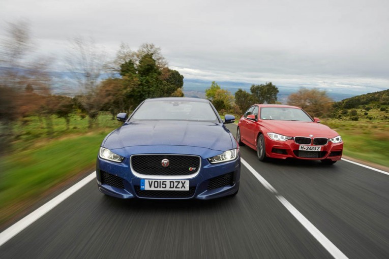 2015-bmw-335i-m-sport-2017-jaguar-xe-s-front-end-in-motion-03