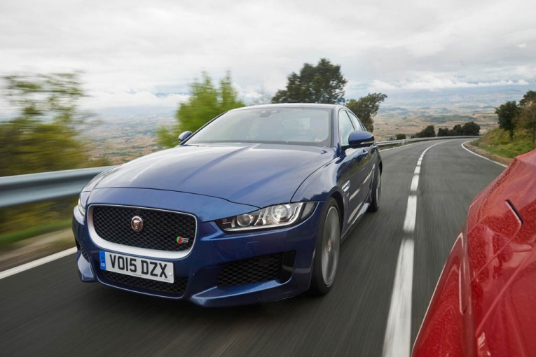 2015-bmw-335i-m-sport-2017-jaguar-xe-s-front-three-quarters-in-motion-02