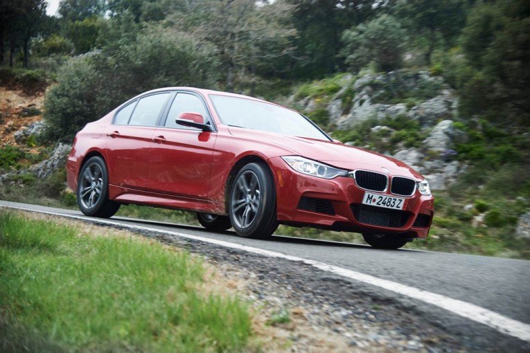 2015-bmw-335i-m-sport-front-three-quarter-in-motion-02