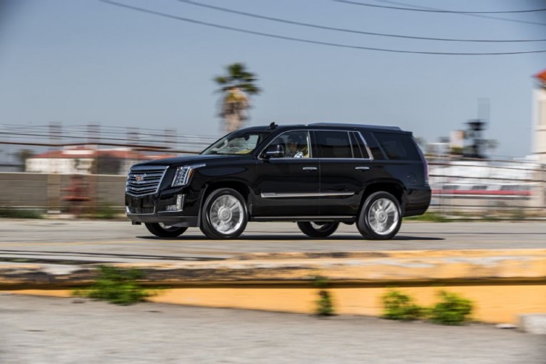 2015-cadillac-escalade-platinum-side-in-motion